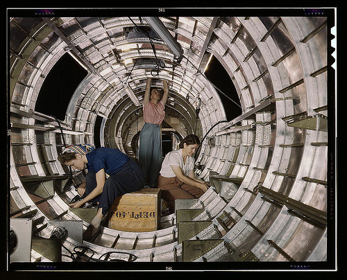 Women workers install fixtures and assemblies to a tail fuselage section of a B-17F bomber at the Douglas Aircraft Company, Long Beach, Calif. Better known as the "Flying Fortress," the B-17F is a later model of the B-17 which distinguished itself in acti