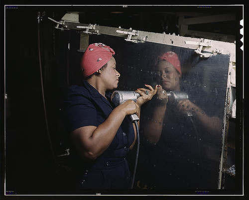 Operating a hand drill at Vultee-Nashville, woman is working on a "Vengeance" dive bomber, Tennessee  (LOC)